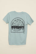 Kin Ship Goods light blue/green pocket tee with ‘Take the Back Roads’ mountain and orchard graphic on back, perfect for slow travel and scenic drives.