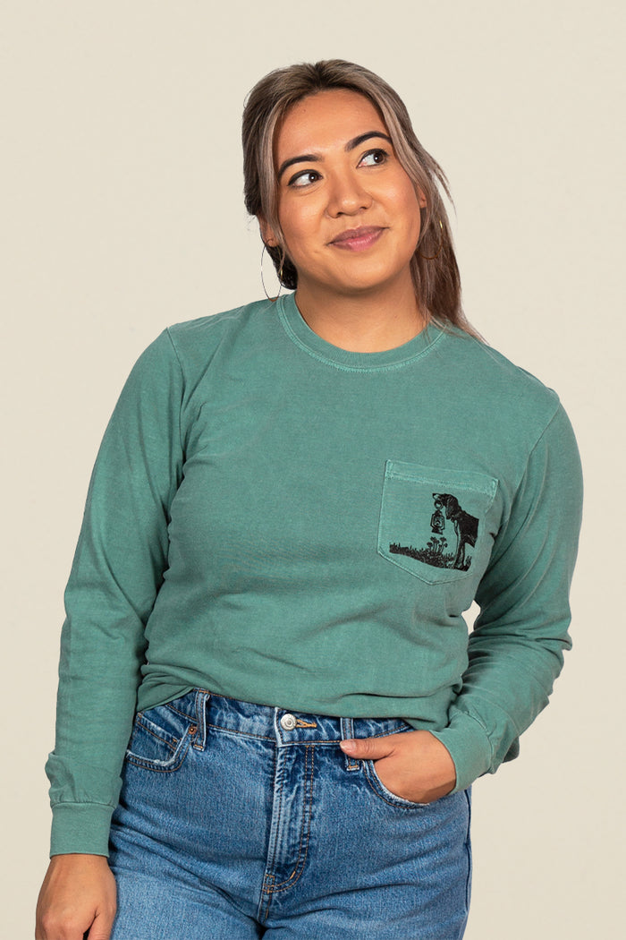 Kin Ship Goods teal long sleeve with ‘Comfort for all Creatures’ mountain dog graphic on back, screen printed in black ink.