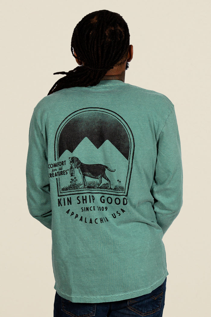 Kin Ship Goods teal long sleeve with ‘Comfort for all Creatures’ mountain dog graphic on back, screen printed in black ink.
