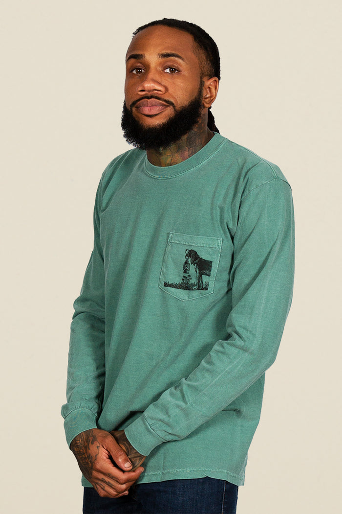 Kin Ship Goods teal long sleeve with ‘Comfort for all Creatures’ mountain dog graphic on back, screen printed in black ink.