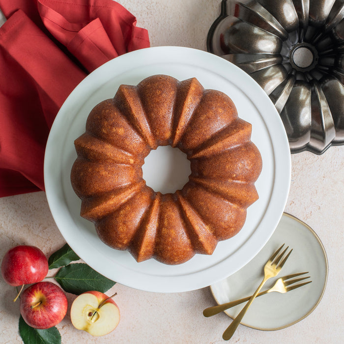 Nordicware traditional Bundt pan for baking bread and cakes, with a detailed decorative pattern in a close-up shot.
