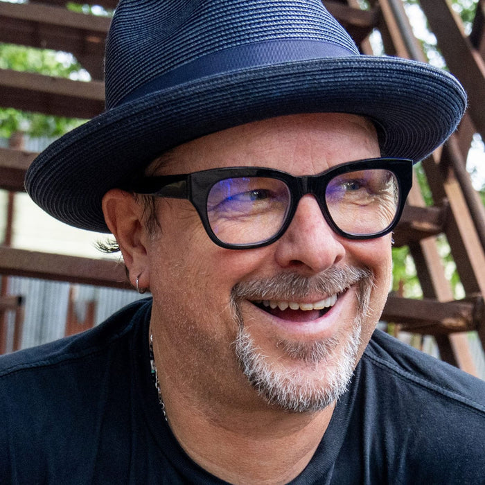 Caddis Miklos Reading Glasses in Minor Blues on a model at Addison West