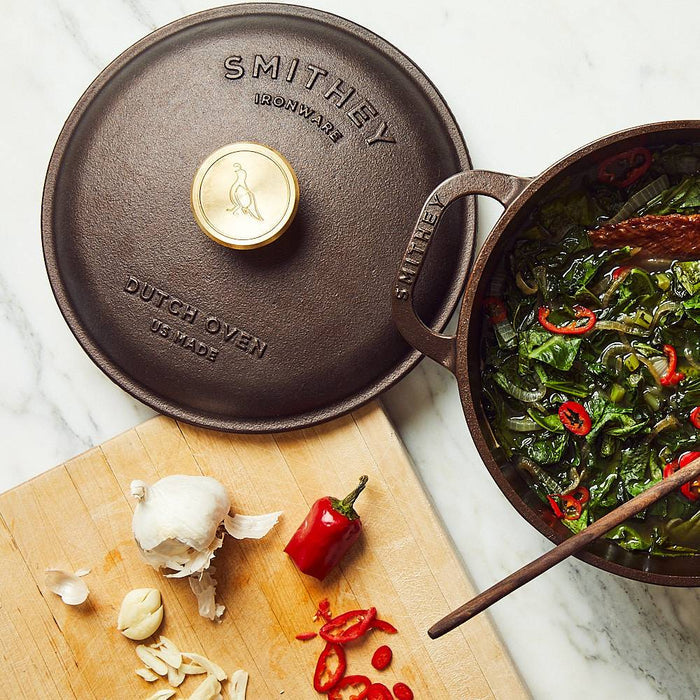 Smithey Ironware 5.5 Qt cast iron Dutch oven with lid, black and sturdy for slow cooking and roasting.
