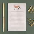 Clever Ideas Notepad fox notepad on a green table at Addison West