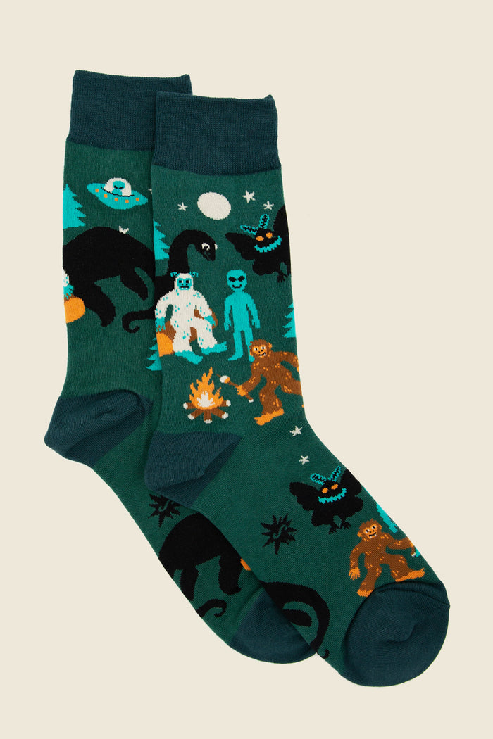 Cryptid crew socks with Bigfoot, Mothman, and alien campfire scene – Kin Ship Goods spooky Appalachian novelty socks