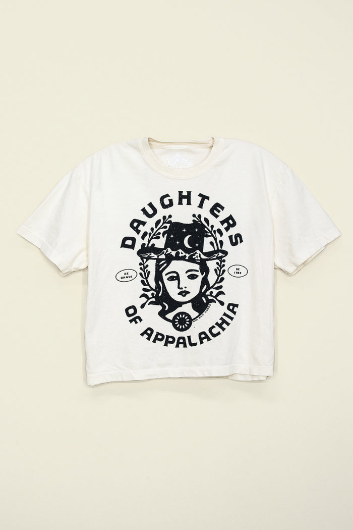 Kin Ship Goods Daughters of Appalachia tee in cream with bold black graphic, modeled with a relaxed fit and casual style.