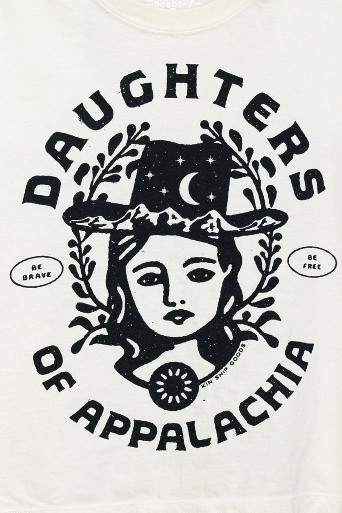 Kin Ship Goods Daughters of Appalachia tee in cream with bold black graphic, modeled with a relaxed fit and casual style.