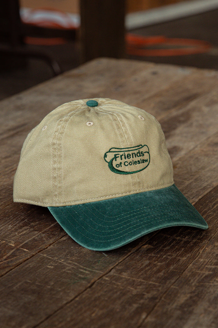 Kin Ship Goods Friends of Coleslaw dad hat with green embroidered logo—khaki and forest green cotton cap with Appalachian flair.