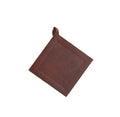 Full grain leather potholder from Smithey Ironware, sturdy heat-resistant kitchen accessory with a textured leather surface.
