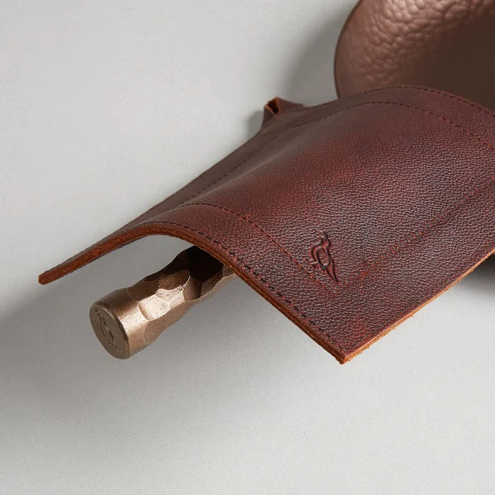 Smithey Ironware full grain leather potholder with durable, textured leather surface for heat protection and stylish kitchen use.