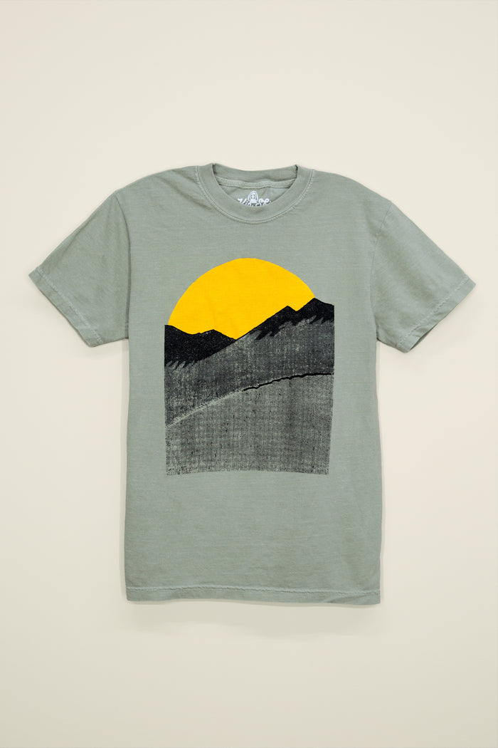 Kin Ship Goods sage green tee with minimalist sunrise over mountains graphic in black and gold, inspired by Appalachian mornings.
