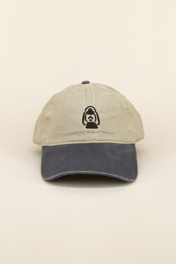 Khaki and black Kin Ship Goods baseball cap with black embroidered lantern graphic, angled on neutral background.