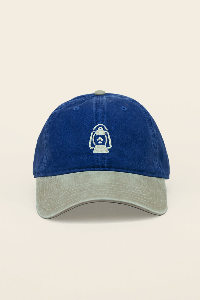 Kin Ship Goods lantern hat with navy crown and khaki brim—embroidered Appalachian lantern logo on classic cotton dad cap.
