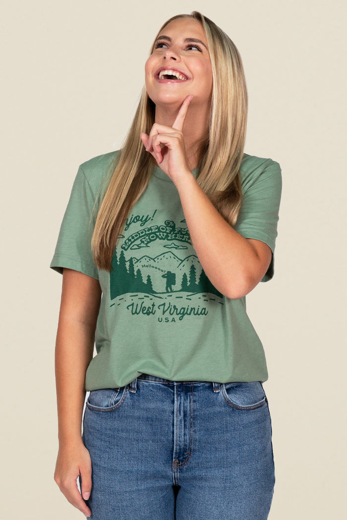 Kin Ship Goods green tee with forest scene and ‘Middle of Nowhere, West Virginia USA’ graphic, perfect for outdoor lovers.