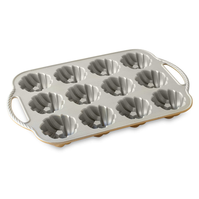 Nordicware Mini Braided Bundt Pan for bread and cake, interior view showing detailed braided design in a baking pan.