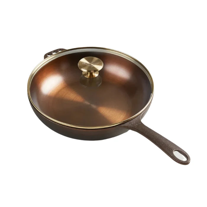 Smithey Ironware No. 11 cast iron skillet with glass lid, heavy-duty cooking pan for frying and searing.
