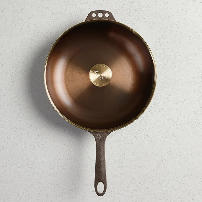Smithey Ironware No. 11 cast iron skillet with glass lid, durable black skillet for frying and baking.