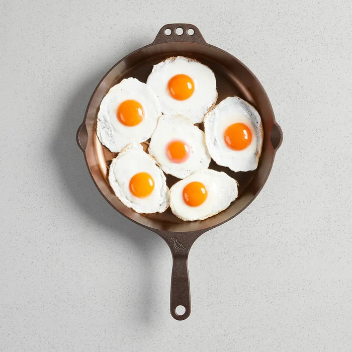 Smithey Ironware No. 12 cast iron skillet with a smooth cooking surface and sturdy handle for versatile stovetop and oven use