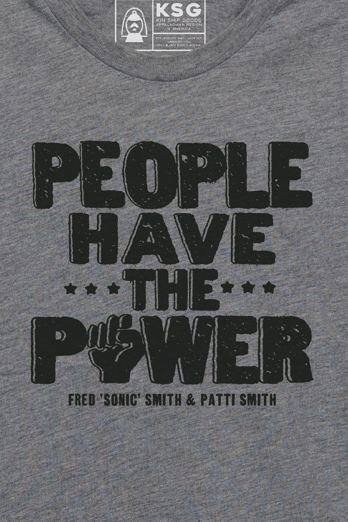 Kin Ship Goods gray kids tee with “People Have the Power” design from official Patti Smith collab, inspired by her iconic lyrics.