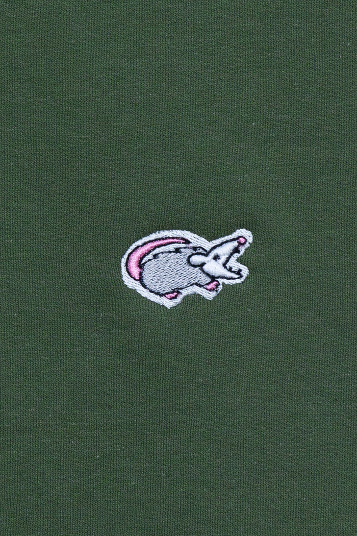 Forest green Kin Ship Goods sweatshirt with small embroidered possum patch on chest, laid flat on neutral background.