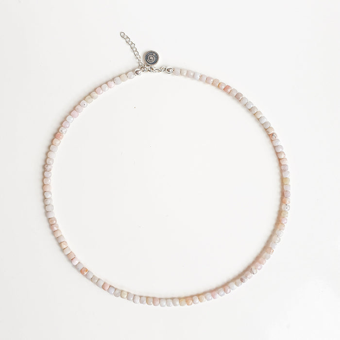 Necklace with small beads on a light background