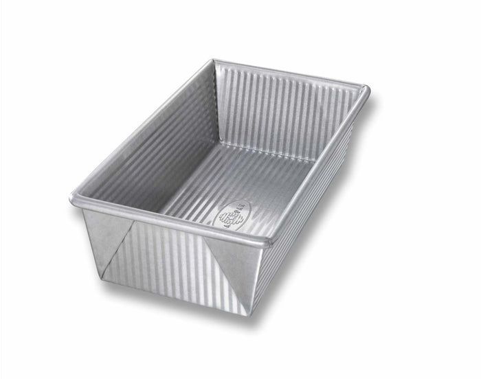 USA Pan small loaf pan for bread and cake baking, 1 lb capacity, durable non-stick bakeware for even baking.