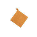 Smithey Ironware suede potholder with textured surface, designed for heat protection in kitchen cooking and baking tasks.