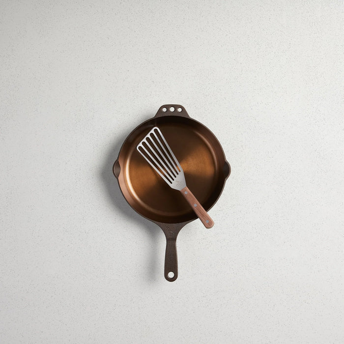 Smithey Ironware walnut-handled spatula from 1616 Cooking Utensils collection, featuring a wooden handle and stainless steel spatula head.