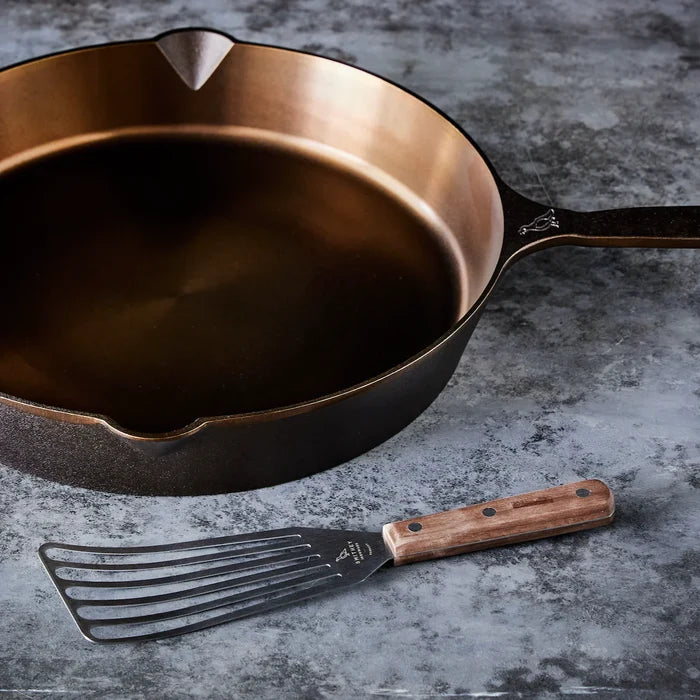 Smithey Ironware Walnut Handled Spatula from 1616 Cooking Utensils set, featuring a wooden handle and stainless steel blade.