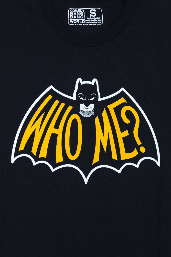 Kin Ship Goods black t-shirt with yellow 'WHO ME?' logo in batwing shape—official merch for WHO ME? An Extremely True Crime Podcast.
