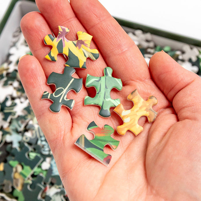 Winter Flora & Fauna 1,000 Piece Puzzle held by a model at Addison West